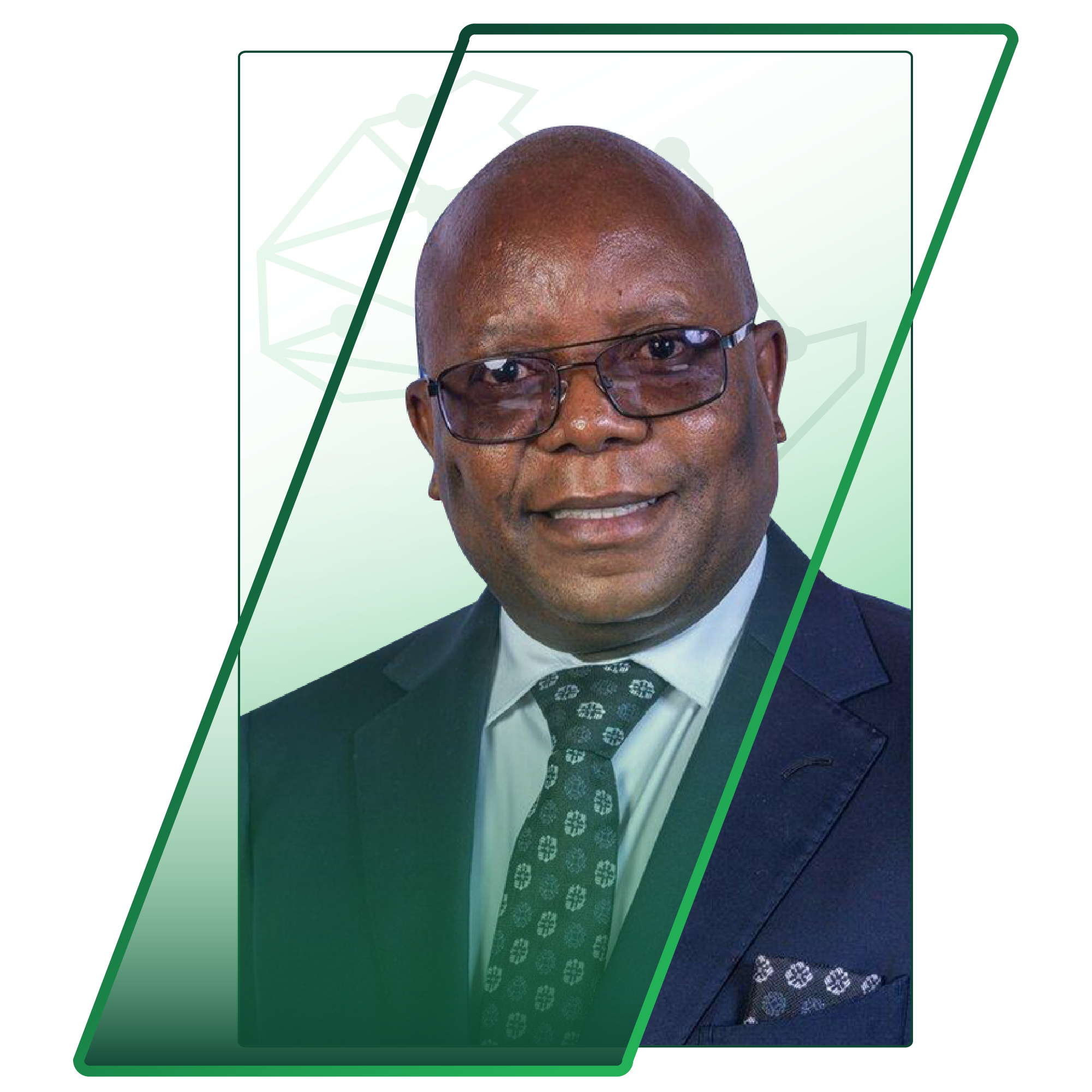 Portrait of a man in a suit and tie wearing glasses, smiling at the camera, with a green decorative frame behind him.