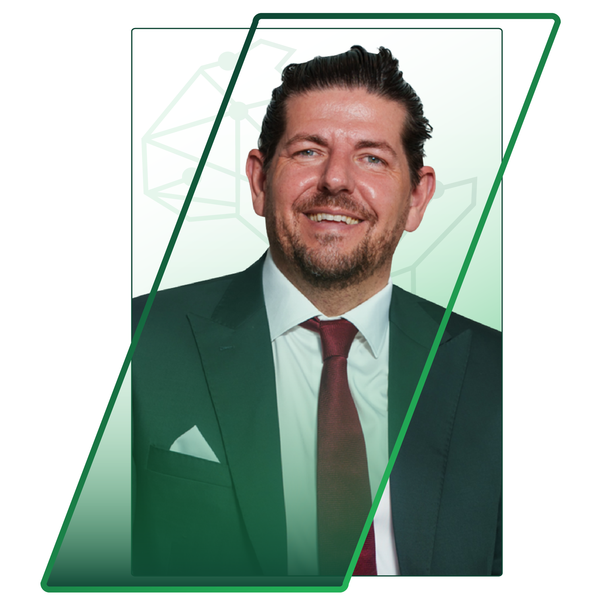 Smiling man in a suit, head-and-shoulders portrait with geometric green graphics overlay on a pale background.